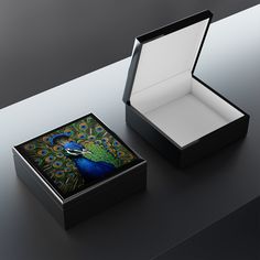 an open box with a peacock design on it