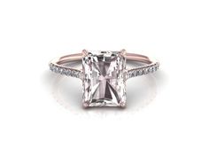 an engagement ring with a princess cut diamond and pave diamonds on the sides, in rose gold