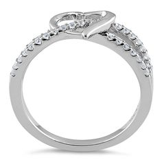 Top of ring height: 8.5mm

         Top of ring width: 9.6mm

      Band width:  4.8mm

      Shank width: 1.9mm

    
        Stone material:  clear cubic zirconia  

      Stone shape:  round

      Total number of CZ    stones: 33

      Stone setting:  prong setting

   
       Metal:  925 sterling silver

      Plating:  rhodium plated    (what is rhodium?) What is Rhodium? 
 
   If you're not familiar with Rhodium, it's a rare metal in the platinum   group, and at over $20,000 per KG, it's Cubic Zirconia Round Band Promise Ring, Cubic Zirconia Heart Ring With Pave Setting For Wedding, Formal Heart Shaped Cubic Zirconia Diamond Ring, Cubic Zirconia Heart Cut Halo Ring For Promise, Classic Cubic Zirconia Bypass Promise Ring, Cubic Zirconia Diamond Ring With Brilliant Heart Cut, Formal Heart Ring With Center Stone In Cubic Zirconia, Cubic Zirconia Heart Ring With Prong Setting, Heart Shaped Cubic Zirconia Rings For Formal Occasions