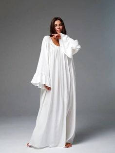 Bohemian Maxi Dress | Relaxed White Flowy Gown Embrace effortless elegance with this stunning bohemian-style maxi dress. Featuring a relaxed, oversized fit, this gown is perfect for those who value both comfort and style. The flowing silhouette and delicate gathers around the neckline create a soft and ethereal look, ideal for casual gatherings, beach events, or simply lounging in style. Details:     Color: Pure white     Relaxed, oversized fit for maximum comfort     Flowy, lightweight fabric t Flowy Bohemian Boho Dress For Daywear, Bohemian Maxi Dress For Daywear, Bohemian Maxi Boho Dress, Flowy Boho Dress For Daywear, White Billowy Long Sleeve Maxi Dress, Flowy Floor-length Maxi Dress For Daywear, Relaxed Fit Maxi Dress For Daywear, Billowy Long Sleeve Maxi Dress For Daywear, Floor-length Spring Loungewear Dress