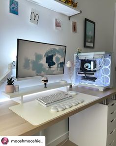 a desktop computer sitting on top of a wooden desk