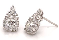 This design is so elegant. She will never take these off her ears. Boasting 1.47ctw of diamonds these earrings have a flower motif that makes them so unique and beautiful.Metal: 18kt White GoldDiamond Weight: Center (2) 0.76, (260 0.71ctw Totaling 1.47ctwDiamond Shapes: RoundsMeasurements: W13mm x L9mmBacking: Push Back Flower Motif, Elegant Flowers, Flower Earrings, A Flower, Diamonds, Flowers, White, Design