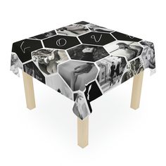 a table covered with photos and words on top of wooden legs in front of a white background