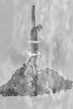 a black and white photo of a man standing on top of a hill with his surfboard in the water