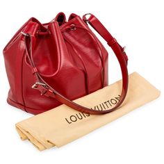 The Noe bucket bag is crafted from Louis Vuitton's signature Epi leather and silver hardware, and features an open top with a drawstring for easy access. The inside features a large compartment lined in faux suede for a luxurious feel. SPL Exterior Red Epi leather Silver hardware Drawstring closure One detachable and adjustable shoulder strap TJ3153 - date code Great condition - some scratches to base and light creasing around the bag. Interior Red faux suede interior Spacious interior One zip pocket Louis Vuitton embossed logo Excellent condition - light signs of wear but well kept Dust bag included SPL Height 26cm Width 25cm Depth 20cm Dior Shoes, Diaper Backpack, Leather Silver, Open Top, Bags Designer Fashion, Casual Backpack, Exclusive Bag, Embossed Logo, Chanel Handbags