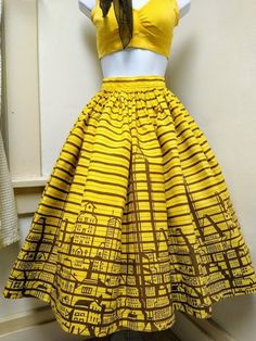 ALL SALES FINAL. PLEASE ASK QUESTIONS PRIOR TO PURCHASE. THANK YOU. This is a true vintage 1950s/1960s Novelty print cotton FULL SKIRT. Pin up/ Rockabilly style. This is a handmade skirt. Colors are YELLOW and BROWN. --**LISTING IS FOR SKIRT ONLY. --** The skirt is made of cotton with a novelty print of pinstripes and a city skyline. Skirt fastens in back with two brown plastic buttons and a metal zipper. The skirt is pleated and very full. Shown with a crinoline petticoat that is not included. 1960s Skirt, 70s Mini Dress, 1950s Skirt, Handmade Skirts, Rockabilly Style, Rockabilly Fashion, Border Print, Polyester Dress, Novelty Print