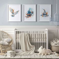 a baby's room with three paintings on the wall and two cribs