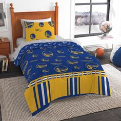 a basketball themed bed in a bedroom