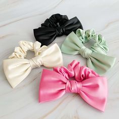 Satin Bow Tie Hair Scrunch Enhance your hairdo with this exquisite satin hair scrunchie featuring a charming bow tie detail. Crafted from high-quality materials, this accessory is designed to add a touch of sophistication to any hairstyle. Perfect for both casual outings and formal occasions, this versatile hair scrunchie is a must-have accessory in your collection. The dimensions of this scrunchie are approximately 5.5" x 3" x 1", ensuring a comfortable fit for various hair types. Key Features: High-quality satin material Chic bow tie detail Suitable for both casual and formal events Bow Tie Hair, Diy Hair Scrunchies, Tie Hair, Hair Setting, Satin Bow, Satin Material, Scrunchie Hairstyles, Hair Accessories Headbands, Headband Hairstyles