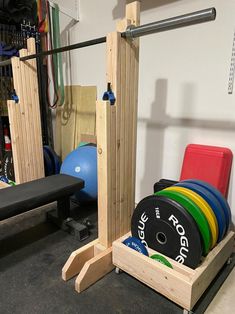 the gym equipment is neatly organized and ready to be used by someone in their home