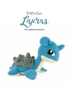 a crocheted blue and white dragon sitting next to the caption for patron lapras