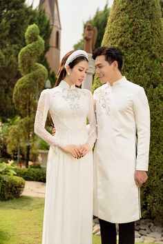 Traditional collar Fabric: Crepe, lace, beading Long sleeves Type: Modern ao dai Traditional Long Sleeve Gown For Banquet, Fitted Ao Dai With Lace Sleeves For Wedding, Elegant Ao Dai With Stand Collar For Wedding, Elegant Ao Dai With Lace Sleeves For Wedding, Elegant Wedding Ao Dai With Lace Sleeves, Fitted Lace Ao Dai With Long Sleeves, Traditional Long Sleeve Ao Dai For Banquet, Elegant Ao Dai With Lace Sleeves For Ceremony, Elegant Wedding Gown With Embroidered Sleeves