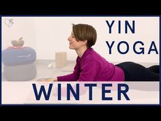 a woman laying on the floor in front of a yoga mat with text overlay reading yin yoga winter