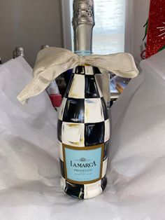 a wine bottle with a bow on it