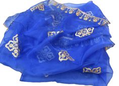 Pattern - an embroidered scarf. Ideal for - women/ girls. Occasion - formal or casual. Ideal for functions or parties. Fabric - organza silk, has a fine texture with a nice fall. Color - blue, on blue background floral embroidery, is with golden gota thread. Size - 34 x 100 inches approx. Can be wrapped in different styles. Care - gentle hand wash. For more such scarves please visit- For more such scarves For all orders, $120 and above, it will be express delivery through DHL confirmed delivery Blue Embroidered Organza Dupatta, Traditional Blue Scarf As Gift, Traditional Blue Scarves For Festive Occasions, Traditional Blue Festive Scarves, Traditional Blue Scarf For Festive Occasions, Blue Organza Dupatta For Celebration, Elegant Embroidered Blue Shawl, Blue Shawl For Wedding And Festivals, Embroidered Blue Shawl For Wedding