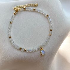 Moonstone Gold Filled Bracelet. Delicate Crystal Bracelet. - Etsy Gold Moonstone Beaded Bracelet As A Gift, Gold Beaded Bracelets With Moonstone, Moonstone Bracelet With Moon Charm As Gift, Gold Moonstone Bracelets With Natural Stones, Spiritual Gold Beaded Bracelets With Moonstone, Dainty Beaded Moonstone Jewelry, Handmade Gold Moonstone Beaded Bracelets, Minimalist Moonstone Bracelets With Round Beads, Minimalist Moonstone Bracelet With Round Beads