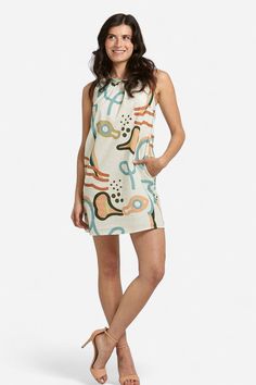 Elevate your summer wardrobe with our Camilla Abstract Print Linen Mini Dress! Made with lightweight linen, it features a high neckline, sleeveless silhouette, and convenient side-seam pockets. Pair it with our Zoe Orange Bow sandals for a casual day look or dress it up with heels for a chic night-time ensemble. Embrace the warm weather in style and comfort with this versatile piece. Made in Italy by BravaaComposition:100% LinenFit:Model 1 is wearing a size Small. Model's measurements: Height 5' Casual Beige Halter Neck Sleeveless Dress, Summer High Neck Beige Dress, Beige High Neck Summer Dress, Unlined Linen Dress For Day Out, Beige High Neck Dress For Summer, High Neck Beige Dress For Summer, Casual Sleeveless Unlined Dress For Beach, Casual Unlined Sleeveless Beach Dress, Casual Unlined Sleeveless Dress For Beach