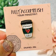 a pin with a cup of coffee on it