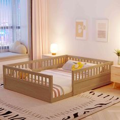 a small child's bed in the corner of a room with a rug on the floor