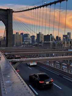 cars are driving over the bridge in new york city