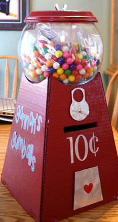 a gummy machine sitting on top of a wooden table