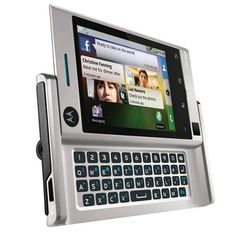 an image of a cell phone that is attached to a tablet pc with keyboard keys