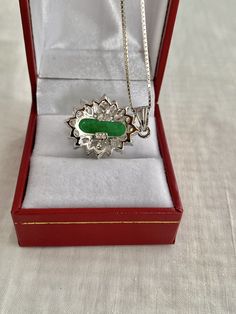 "Free Shipping on orders over $35.00 however if there is a return buyer to refund seller for the free shipping cost to seller. Stunning Necklace Pendant Oval Simulate Cabochon Jade CZ Marquise & Round Accents 925 Sterling Silver Pendant Box Chain Hallmark - 925 Chain .& pendant marked 925 Top measures - 0.95\" x 0.81\" Beautiful like new Visit our Etsy shop's HauteCoutureLaLa TrendsCouture BeautifulPatina LastingTrends BorrowedTrendsFree Shipping on orders over $35.00 however if there is Hallmarked Oval Jade Necklaces, Oval Jade Necklaces With Hallmark, Silver Jade Oval Pendant Jewelry, Oval Jade Necklace For Anniversary, Silver Jade Necklace With Oval Pendant, White Gold Oval Cabochon Necklace Gift, Silver Jade Cabochon Necklace, Silver Necklace With Jade Cabochon, Oval Cabochon Jade Jewelry Gift