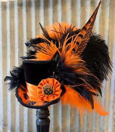 Cute kitties everywhere! The topper and brim are a cute black cat print with the stack of a crushed black velvet. The feathers are exceptional! Purrrfect for Halloween!  ---------------------------------------------------------------------------- It measures 3 1/2" high by 4 1/2"x 5" wide at the base. A demonstration of the different sizes of hats....this hat is considered a "small" size. Here is what the "small" size looks like on real people. https://www.etsy.com/listing/521693558/example-list Cheap Halloween Hats With Short Brim, Cheap Brimmed Top Hat For Parties, Cheap Halloween Hat With Short Brim, Cheap Short Brim Halloween Hats, Cheap Halloween Party Top Hat, Elegant Top Hat For Parties, Luxury Festival Top Hat With Short Brim, Whimsical Halloween Hat, Cheap Playful Halloween Hats