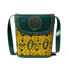 Soak in the Indianness of the Vibrant Heritage Ajrakh Satchel, a symphony of contrasting green and yellow hues adorned with ethnic ajrakh motifs. The structured tote, crafted from pure cotton fabric with broad leather handles, offers versatility as a crossbody or shoulder bag. The circular cutout on the leather flap, secured with a metal magnetic button, adds a unique touch. With a spacious central compartment, it accommodates books, journals, diaries, and even an iPad, blending ethnic tradition Traditional Yellow Shoulder Bag For Everyday Use, Traditional Yellow Bags For Everyday Use, Green Everyday Bags For Festivals, Traditional Yellow Bag For Everyday Use, Traditional Green Shoulder Bag For Daily Use, Traditional Green Shoulder Bag For Everyday, Traditional Yellow Shoulder Bag For Daily Use, Traditional Multicolor Satchel For Everyday Use, Green Bohemian Bags For Festivals