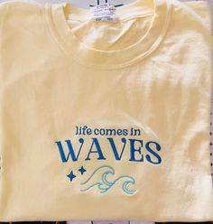 Embroidered life comes in waves comfort color tee available in several colors ,  Tee Shirt description : *Tee is true to size ,preshrunk/Relaxed fitting and is made from 100% ring spun cotton.   -Size Chart is listed in Images!  - Size up for oversize look! **Shirt is made to order, and processing time is 5 business days. Due to nature of handmade goods returns or exchanges are not excepted for this order but if you have any issues, please message me and I would be more than happy to help you! Ocean Tshirt Design, Embroidered Cotton T-shirt For Beach, Custom Embroidered Relaxed Fit T-shirt For Summer, Beach Embroidered Short Sleeve T-shirt, Embroidered Short Sleeve Beach T-shirt, Embroidered Short Sleeve T-shirt For Beach, Graphic Tee With Custom Embroidery For Summer, Custom Embroidery Graphic Tee For Summer, Custom Embroidered Graphic Tee For Summer