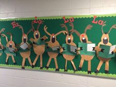 a bulletin board with paper cut out of reindeers