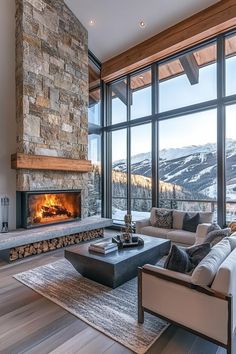 a living room with large windows and a fireplace