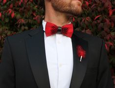 The Jaxon Feather bow tie is a classic red and black tie that will keep it sharp and your look formally fresh. It is a classic, understated, and unique groom's tie. Perfect for weddings and special events. An absolute must-have bow tie to add to your collection. This sleek red tie also comes in children's sizes so your groomsmen and ring bearer bow ties can match! Every Feather Bow Ties Comes with: Beautiful, Hand-Crafted, High Quality Feather Bow Tie, with an adjustable strap that can fit up to Red Ties For Black-tie Events, Classic Red Suit And Tie Accessories For Groom, Classic Black Bow Tie For Groom, Dapper Red Suit And Tie Accessories For Formal Events, Dapper Red Suit And Tie Accessories For Formal Occasions, Elegant Red Suit And Tie Accessories For Groom, Dapper Bow Tie For Black-tie Events, Dapper Bow Tie For Formal Occasions, Dapper Tuxedo With Ties For Groom