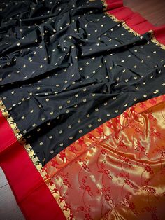 Gorgeous Statement designer Saree by Kaash Collection. Black Saree with small Buttis all over the body of the Saree. Plain Red Color Borders. Item : SareeColor : Black and RedBase Fabric : Soft Banarasi Silk Blouse piece : Comes with Blouse pieceFall & Edging(Yes/No) : Yes Disclaimer :-- Color variation is possible due to various reasons like phone or desktop setting, resolution etc. Please don't hold us responsible. Our aim is to put the exact color of the Saree.- If the Saree is Pure Silk, we Black Color Saree, Saree Plain, Plain Red, Men's Ethnic Wear, Bandhani Saree, Black Saree, Kanjivaram Sarees, Readymade Blouse, Designer Saree