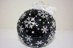 a black and white ornament with snowflakes on it