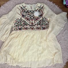 Cute Dress/Tunic Beige Tunic Dress With Floral Embroidery, Red Short Sleeve Tunic For Spring, Floral Embroidered Bell Sleeve Blouse For Summer, Summer Floral Embroidered Bell Sleeve Blouse, Summer Bell Sleeve Blouse With Floral Embroidery, Spring Beige Dress With Embroidered Sleeves, Bohemian Flowy Embroidered Top With Floral Design, Bohemian Beige Mini Dress With Floral Embroidery, Beige Bohemian Mini Dress With Floral Embroidery