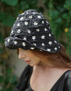 For stepping out in style on beautiful sunny days, our Flora Hat is the perfect addition to your wardrobe for any occasion, from having a relaxing picnic on the grass to enjoying your time with friends at an outdoor concert. This gorgeous crochet hat made from 100% cotton yarn, complete with an eye-catching flower pattern, is designed to give you a fun and feminine fit. A must-have collection for creating a cute and casual look. Hand-crocheted with love by our female artisans from their very own Casual Black Crochet Hat For Outdoors, Trendy Black Handmade Crochet Hat, Summer Black Crochet Hat, Black Crochet Brimmed Hat, Black Crochet Brimmed Bucket Hat, Gorgeous Crochet, Time With Friends, Cotton Plant, Outdoor Concert