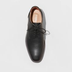 From formal meetings and events to family functions, these Leo Oxford Dress Shoes from Goodfellow & Co™ are a great pick to complete your ensemble. These medium-width shoes feature a cushioned footbed for comfy wear, making them great for both special occasion and everyday wear. With a sleek upper with stitched detailing and a lace-up front, they're perfect for creating a sharp, stylish look. Goodfellow & Co™: Where style & fit are always in good company. Classic Closed Toe Dress Shoes With Cushioned Footbed, Fitted Pointed Toe Dress Shoes With Removable Insole, Elegant Oxfords With Cushioned Footbed, Formal Plain Toe Oxfords With Cushioned Footbed, Business Casual Fitted Closed Toe Dress Shoes, Fitted Closed Toe Dress Shoes For Work, Fitted Closed Toe Dress Shoes For Business Casual, Elegant Formal Lace-up Shoes With Cushioned Footbed, Formal Wingtip Lace-up Shoes With Cushioned Footbed