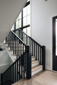 the stairs in this house are black and white