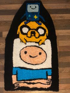 rug with cartoon character on it sitting on wooden floor