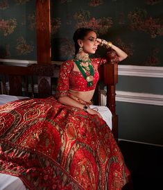 Editor's Note Featuring an elegant interplay of mughal and chintz motifs with intricate hand embroidery on the lehenga. It is paired with a meticulously embroidered blouse with intricate thread and hand beadwork on yoke and sleeves and styled with a co-ordinated dupatta. Fabric: Blouse: viscose silk, dupatta: net, lehenga skirt: viscose silk Color: Hot pink/orange Components: Lehenga, blouse and dupatta Occasion: Sangeet and Wedding Guest Care: Dry Clean Only About the Designer Kalista is a luxu Chanderi Sets With Motifs For Reception, Festive Sets With Motifs For Reception, Brocade Meenakari Sets For Reception, Traditional Meenakari Dresses For Festive Occasions, Brocade Sets With Meenakari For Reception, Navratri Designer Dresses With Meenakari, Traditional Meenakari Dress For Navratri, Raw Silk Meenakari Choli For Receptions, Traditional Navratri Dress With Meenakari