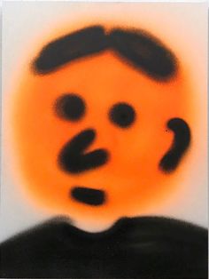 an orange and black image of a man's face