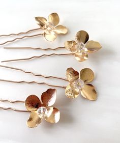 Enhance your special occasion hairstyle with these exquisite flower hair pins. Each pin features a stunning gold flower with a delicate crystal centre, meticulously hand-wired onto a gold hairpin. This set includes four beautiful hair pins, perfect for brides, bridesmaids, flower girls, or any special event. These flowers can be made with a pearl centre instead, please message to enquire. Wedding Baubles, Decorative Hair Pins, Gold Hair Accessories Wedding, Gold Hair Piece, Occasion Hair, Flower Hair Pins, Gold Hair Pin, Special Occasion Hairstyles, Bridesmaid Hair Accessories