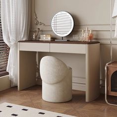 a dressing table with a mirror and stool in front of it, next to a window