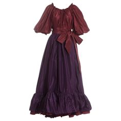 Yves Saint Laurent silk taffeta plum blouse and skirt evening ensemble. Blouse with drawstring collar, bow fastening, and balloon sleeves with elasticated cuff. High waisted tiered plum skirt fastening with a long ribbon, pleated under skirt and metal zip closure. Spring-Summer 1978 1920s Evening Dress, Jersey Evening Dress, Evening Blouses, Burgundy Blouse, Velvet Cocktail Dress, Net Dress, Silk Cocktail Dress, Designer Evening Dresses, New Years Dress