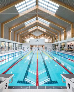 an indoor swimming pool with clear water