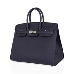 Guaranteed authentic Hermes Birkin Sellier 25 bag featured in chic Blue Indigo.Richly saturated and jewel toned, Hermes Bleu Indigo is gorgeous for year round wear, and completely neutral.Crips and fresh with Palladium hardware.This exquisite Hermes bag is modern and minimalist.A sleek pared down version that exudes chic sophistication.The leather grain is fine and luxe, and the signature sellier edges create a work or art.Epsom leather accentuates this divine colour.Comes with the lock and keys Luxury Chic Blue Bags, Elegant Saffiano Leather Bag With Palladium Hardware, Elegant Everyday Saffiano Leather Bag, Elegant Epsom Leather Bag For Everyday Luxury, High-end Epsom Leather Bag For Everyday Luxury, Shopping Bag With Silver-tone Hardware In Epsom Leather, Timeless Blue Bags With Silver-tone Hardware, Saffiano Leather Top Handle Bag, Epsom Leather Bags With Silver-tone Hardware For Shopping