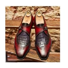 Elevate your shoe game with these bespoke leather handmade shoes. Made with genuine leather, these oxfords come in burgundy, and are available in all US, UK, EU, and AU sizes. The comfortable insole and standard shoe width make them perfect for any occasion. Designed with a solid pattern and lace-up closure, these handmade shoes are a vintage addition to any wardrobe. The leather outsole adds durability and longevity to these unique boots. Customize them to your liking with personalization optio Leather Wingtip Oxfords With Crocodile Pattern, Leather Shoes With Crocodile Pattern And Round Toe, Brown Crocodile Pattern Wingtip Leather Shoes, Brown Crocodile Pattern Leather Wingtip Shoes, Pointed Toe Leather Shoes With Crocodile Pattern, Business Dress Shoes With Crocodile Pattern Leather, Wingtip Leather Shoes With Crocodile Pattern, Leather Monk Strap Shoes With Crocodile Pattern, Brown Leather Shoes With Crocodile Pattern