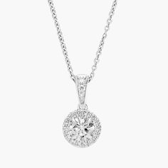 Beautifully crafted, this diamond pendant has a single round brilliant-cut diamond surrounded by sparkling micropave diamonds, a petite necklace that complements any ensemble. Round Diamond Pendant, Petite Necklace, Printable Ring Sizer, Diamond Pendant Necklace, Ring Size Guide, Diamond Fashion, Gia Diamond, Round Brilliant Cut Diamond, Round Brilliant Cut