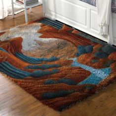 an area rug is on the floor in front of a bed